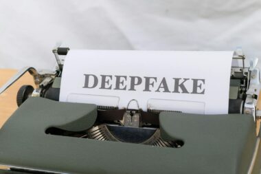 A typewriter with a paper that says deepfake