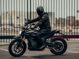 man in black leather jacket riding motorcycle