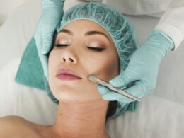 woman doing liposuction on her face