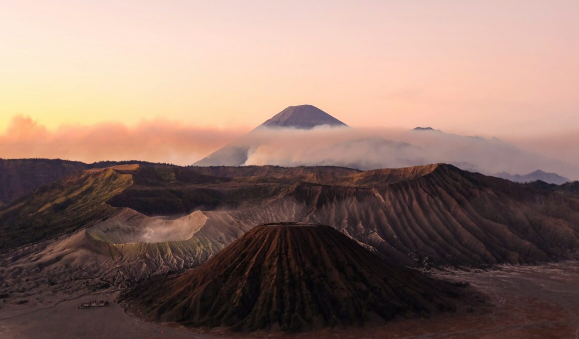 silhouette photo volcanoes during golden hour