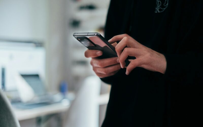 person holding black android smartphone