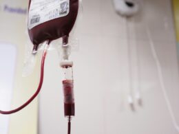 a blood test tube with a blood dropper attached to it