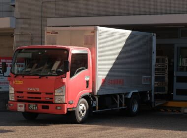 a red truck parked in front of a building