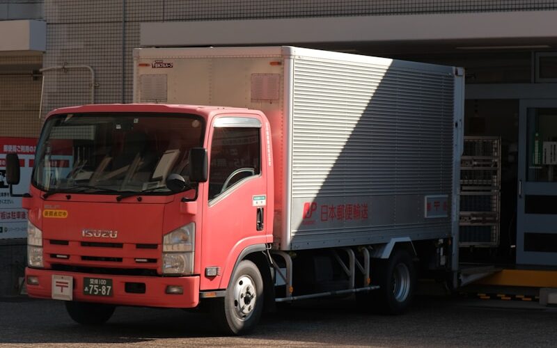 a red truck parked in front of a building