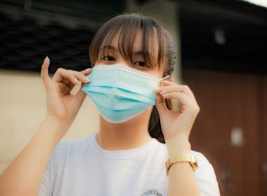 a woman wearing a face mask to protect herself from the sun