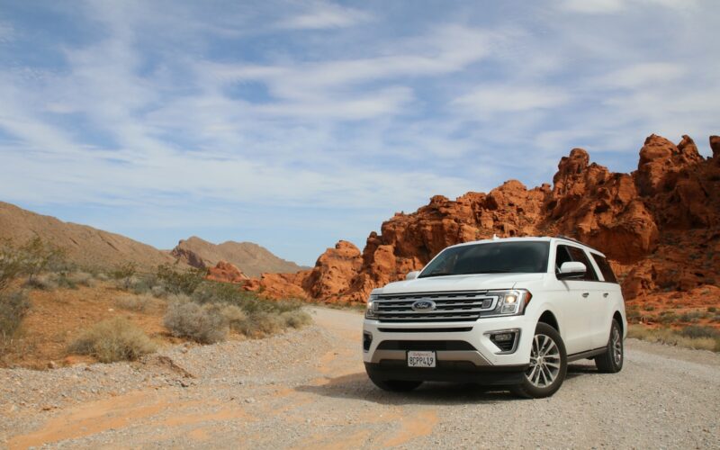 parked white Ford Explorer SUV