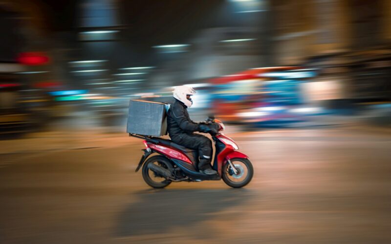 man riding motorcycle on road during daytime