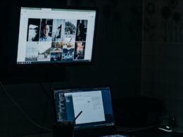 a laptop computer sitting on top of a desk