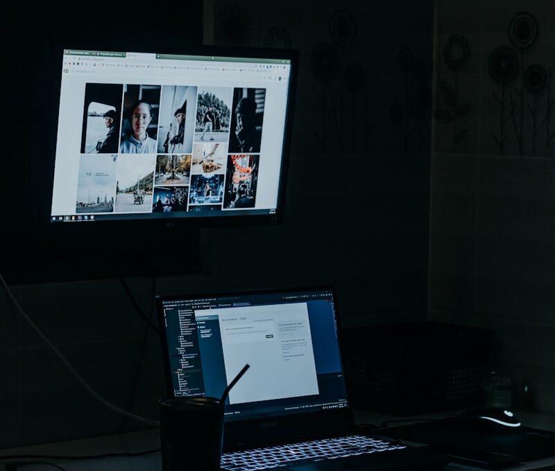 a laptop computer sitting on top of a desk