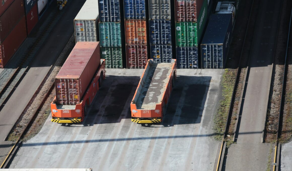 a train yard with cargo containers and train tracks