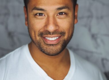 man wearing white V-neck shirt