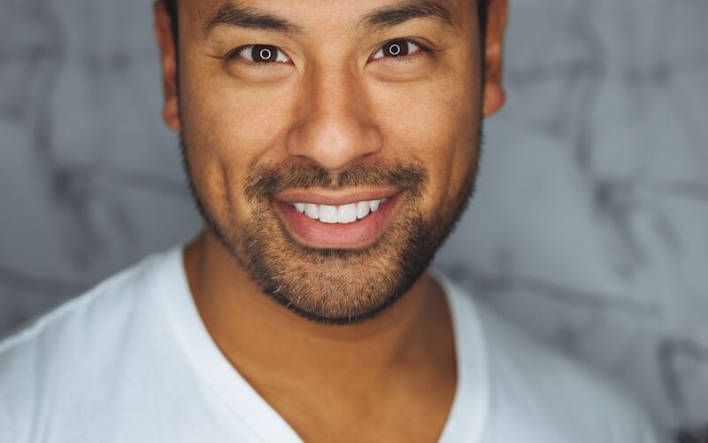 man wearing white V-neck shirt