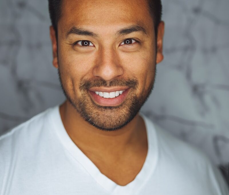 man wearing white V-neck shirt