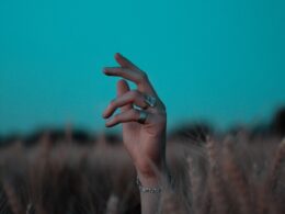 person wearing silver bracelet and bracelet