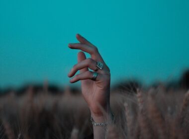 person wearing silver bracelet and bracelet