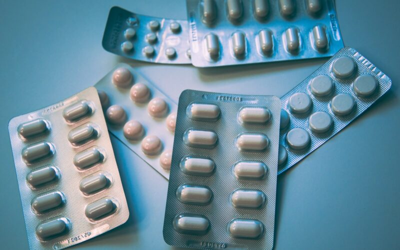 white and blue medication pill blister pack