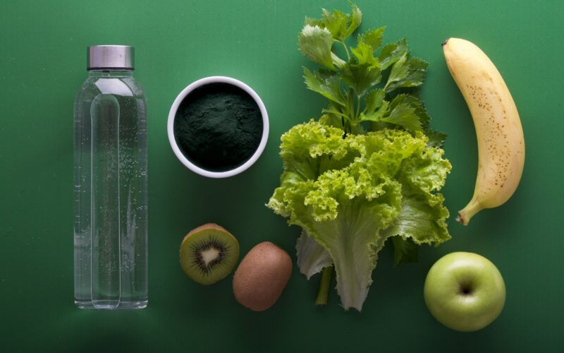 assorted fruits and vegetables on green surface