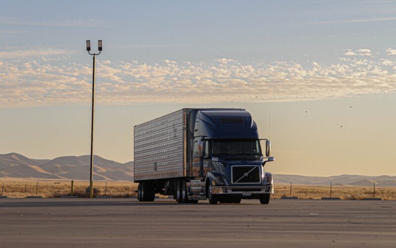 black truck on road during daytime