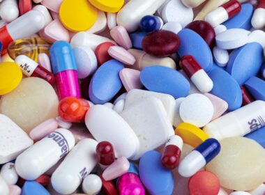 white blue and orange medication pill