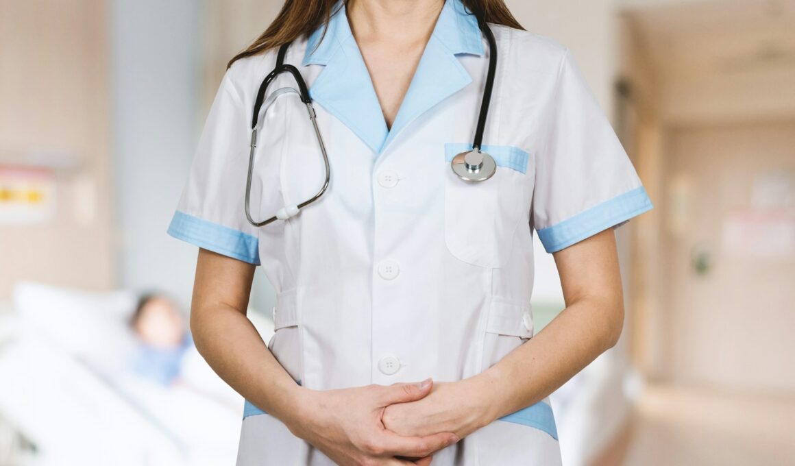 woman in white button up shirt and blue stethoscope