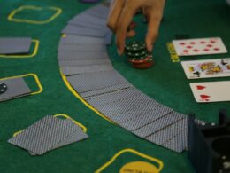 a person playing a game of cards on a table