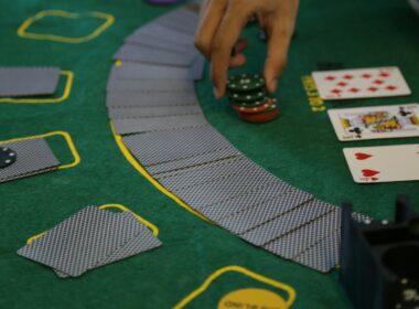 a person playing a game of cards on a table