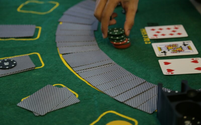 a person playing a game of cards on a table