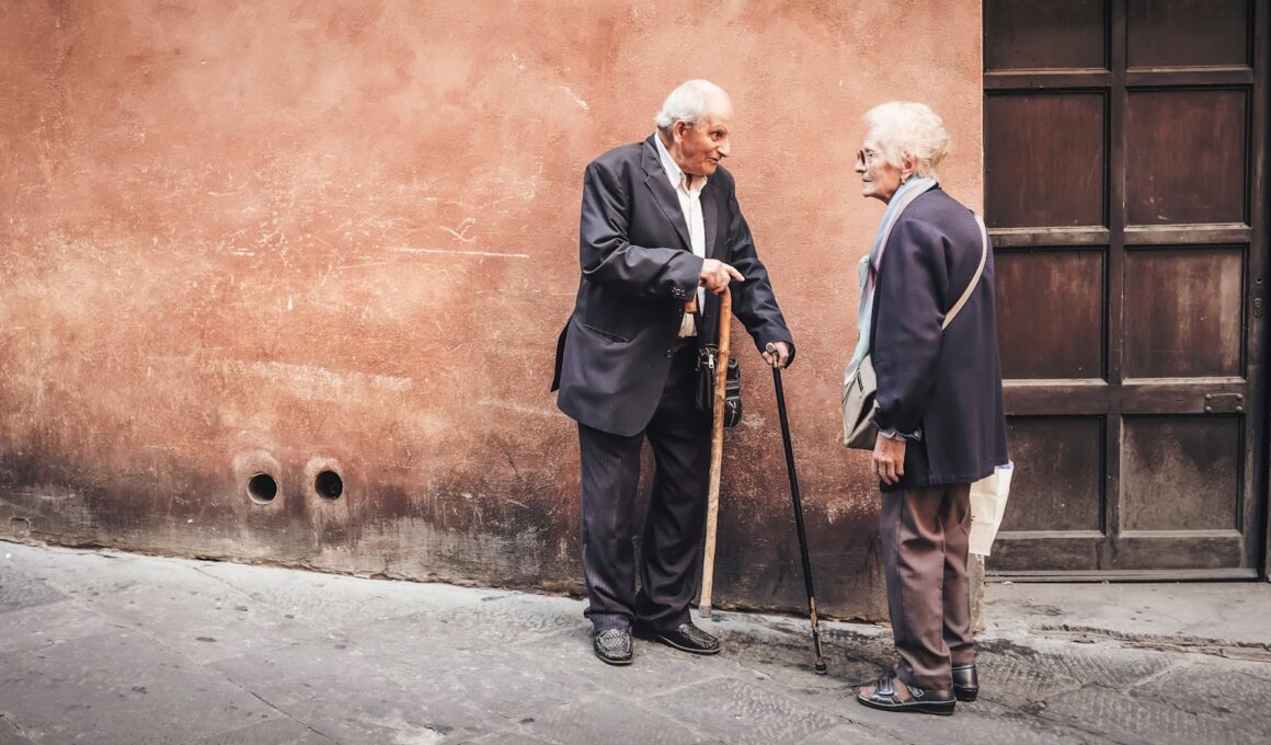 two person talking while standing near wall