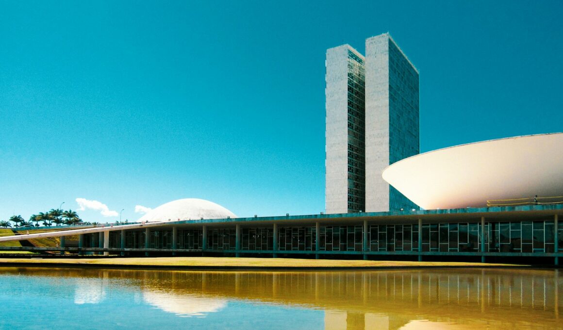 white concrete building near body of water during daytime