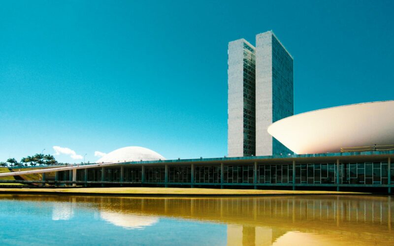 white concrete building near body of water during daytime
