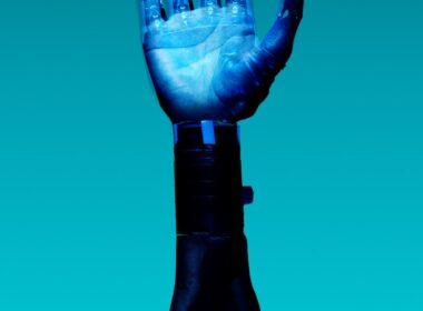 person holding blue light bulb