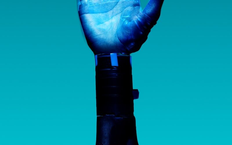 person holding blue light bulb