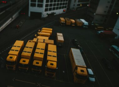 yellow and black bus on road during daytime