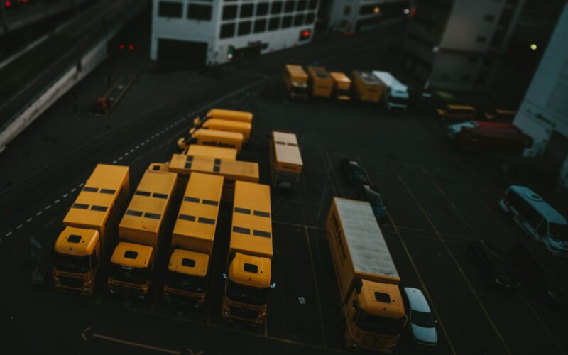 yellow and black bus on road during daytime
