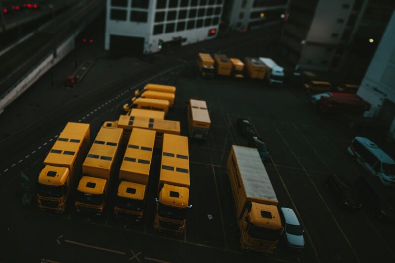 yellow and black bus on road during daytime