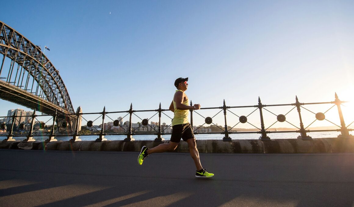 man in yellow tank top running near shore