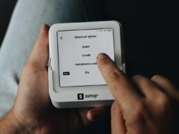 A person is holding a tablet in their hands