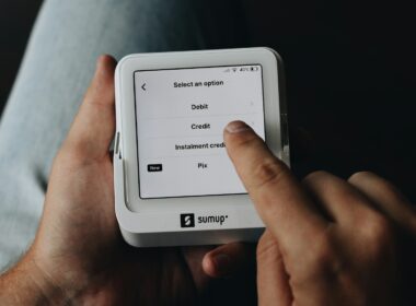 A person is holding a tablet in their hands