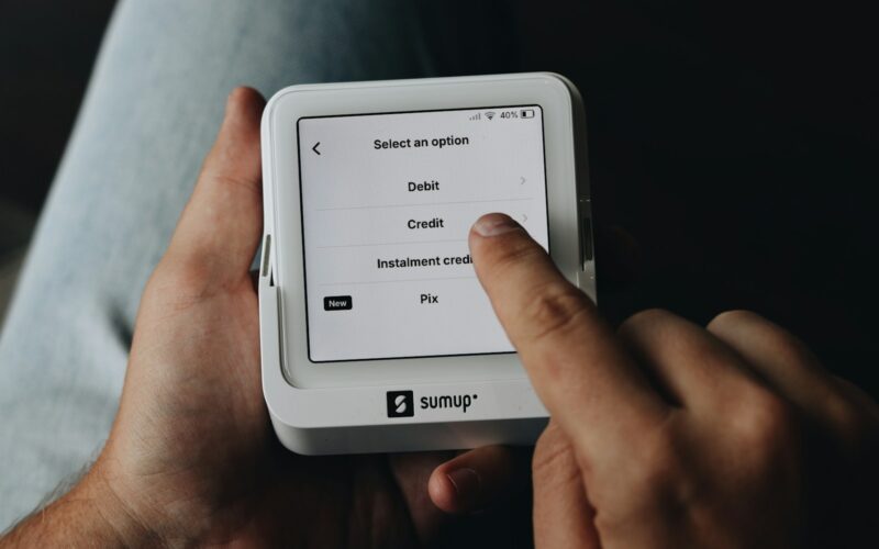A person is holding a tablet in their hands