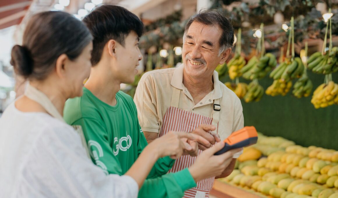 a couple of people standing in front of a fruit stand