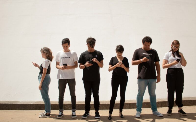 group of people standing on brown floor