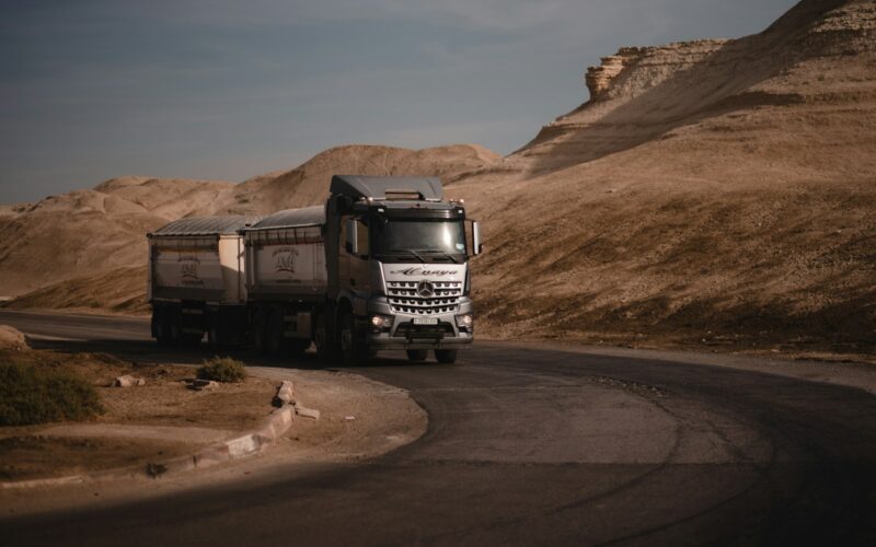 white and black truck on road during daytime