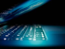 closeup photo of turned-on blue and white laptop computer
