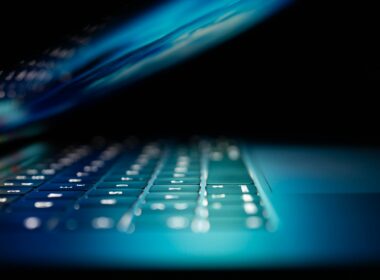 closeup photo of turned-on blue and white laptop computer