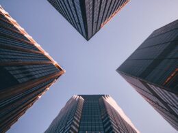 low-angle photography of four high-rise buildings