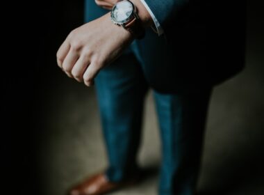 man holding his black suit