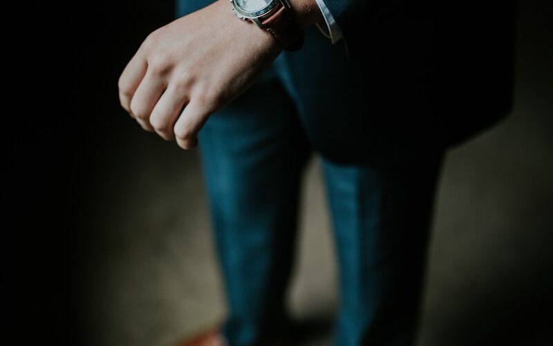 man holding his black suit