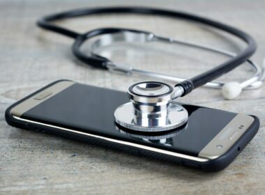 a smart phone with a stethoscope on top of it