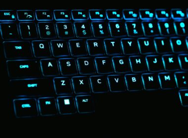 a close up of a keyboard with blue lights
