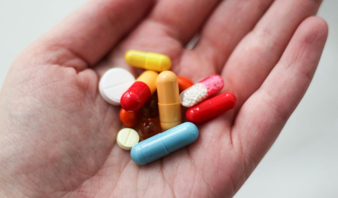 orange and white medication pill on persons hand